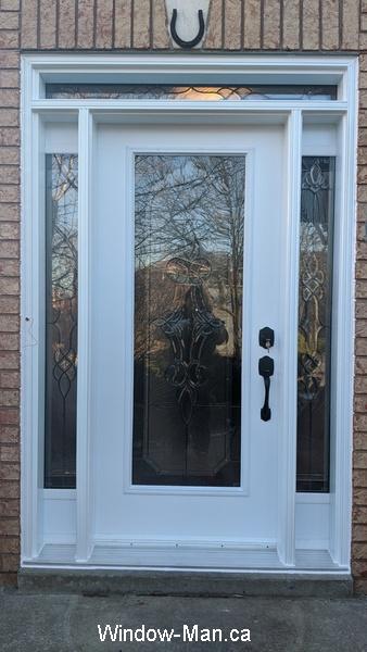 Front door. Two sidelights. Transom. Matching custom stained glass inserts